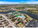 Aerial view of community with lakes, tennis, community center and the location of 20655 Valprato Ct highlighted at 20655 Valprato Ct, Venice, FL 34293