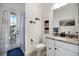 This bathroom features a door leading to the patio and pool area at 20655 Valprato Ct, Venice, FL 34293