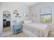 This cozy bedroom features soft natural light and a full sized bed at 20655 Valprato Ct, Venice, FL 34293