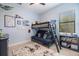 This bedroom features a bunk bed with futon and plenty of room to play at 20655 Valprato Ct, Venice, FL 34293