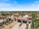 View of the gated community entrance with beautiful landscaping and well-maintained grounds at 20655 Valprato Ct, Venice, FL 34293