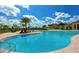 Beautiful community pool with clear blue water, scenic views, and plenty of space for relaxation at 20655 Valprato Ct, Venice, FL 34293