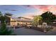 Outdoor event space with wedding setup, reception building, and scenic landscaping at 20655 Valprato Ct, Venice, FL 34293