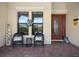 Inviting front porch with stylish seating and decorative accents at 20655 Valprato Ct, Venice, FL 34293