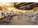 Community gym with modern exercise equipment, TVs, and ample natural light at 20655 Valprato Ct, Venice, FL 34293