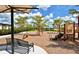 Community playground area with swings, slide, climbing area, and benches at 20655 Valprato Ct, Venice, FL 34293