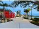 Scenic sidewalk path winds through a lush park near the community offering walking and recreation at 20655 Valprato Ct, Venice, FL 34293