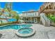 Inviting outdoor space featuring a swimming pool, lounge chairs, lush greenery, two-story house view at 216 Palmetto Ave, Anna Maria, FL 34216