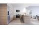 Modern kitchen featuring wooden cabinets, stainless steel appliances, and an island with bar seating at 2170 Robinhood St # A1-304, Sarasota, FL 34231