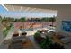 Relaxing outdoor lounge area with comfortable seating, tennis court and swimming pool at 2170 Robinhood St # A1-304, Sarasota, FL 34231
