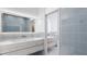 Modern bathroom with double vanity, light wood cabinets, and contemporary tile design at 2170 Robinhood St # A2-305, Sarasota, FL 34231