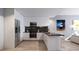 Contemporary kitchen with white cabinets, stainless steel appliances, and marble backsplash, offering modern elegance at 2170 Robinhood St # C1-409, Sarasota, FL 34231