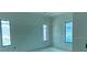Light-filled bedroom with windows for natural light, ready for personalization and finishing touches at 2483 Bay St, Sarasota, FL 34237