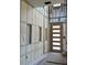 Entryway under construction with insulation and a modern front door at 2483 Bay St, Sarasota, FL 34237