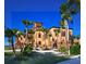 Exterior of a large Mediterranean-style home with lush landscaping at 2483 Bay St, Sarasota, FL 34237