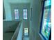 A brightly lit hallway with several large windows, ready to be customized with your own personal touch at 2483 Bay St, Sarasota, FL 34237