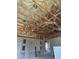 Interior view of exposed beams, drywall, and insulation in new home construction at 2483 Bay St, Sarasota, FL 34237