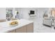 A modern kitchen island in a bright house, showcasing counter space and stylish cabinets at 2483 Bay St, Sarasota, FL 34237