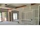 Spacious living room with sliding glass doors for indoor-outdoor living and a decorative built-in entertainment center at 2483 Bay St, Sarasota, FL 34237