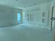 Bright living room featuring a custom entertainment center ready for personal touches at 2483 Bay St, Sarasota, FL 34237