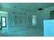 Bright open living space with a custom entertainment center, offering renovation potential at 2483 Bay St, Sarasota, FL 34237