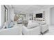 Bright and airy living room featuring modern furniture, recessed lighting, and an open floor plan at 2483 Bay St, Sarasota, FL 34237