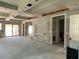 Open-concept living room with sliding glass doors and a decorative built-in entertainment center at 2483 Bay St, Sarasota, FL 34237