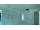 Spacious living room ready for customization, featuring a modern entertainment center at 2483 Bay St, Sarasota, FL 34237