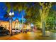 Night view of neighborhood street featuring vintage street lamps and decorative trees lining the block at 2483 Bay St, Sarasota, FL 34237