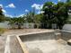 An in-ground pool under construction in the backyard with ample sunlight and potential for a relaxing retreat at 2483 Bay St, Sarasota, FL 34237