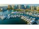 Waterfront view of a marina with many boats docked in the water and city buildings in the background at 2483 Bay St, Sarasota, FL 34237