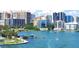 Beautiful waterfront view showcasing serene blue waters, docked boats, and city buildings in the distance at 2483 Bay St, Sarasota, FL 34237