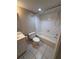 Well-maintained bathroom with white tiled floors and shower at 2700 Coconut Bay Ln # 432, Sarasota, FL 34237