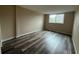 Cozy bedroom with ample natural light and wood-look flooring at 2700 Coconut Bay Ln # 432, Sarasota, FL 34237
