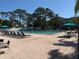 Community pool with lounge chairs and tables for residents to enjoy outdoor recreation at 2700 Coconut Bay Ln # 432, Sarasota, FL 34237