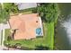 Aerial view showcasing private pool, lush landscaping, and waterside living at 2931 Bravura Lake Dr, Sarasota, FL 34240