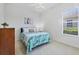 Bright bedroom with a large window, ceiling fan and light walls offers a relaxing retreat at 2931 Bravura Lake Dr, Sarasota, FL 34240