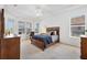 Spacious bedroom with tray ceiling and ample natural light at 2931 Bravura Lake Dr, Sarasota, FL 34240