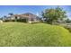 Beautiful home with well-maintained lawn and screened-in patio offers inviting outdoor living at 2931 Bravura Lake Dr, Sarasota, FL 34240