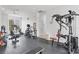 Bright gym featuring modern exercise equipment, rubber flooring, and a ceiling fan to keep you cool during your workout at 2931 Bravura Lake Dr, Sarasota, FL 34240