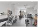 Bright gym featuring modern exercise equipment, rubber flooring, and a ceiling fan to keep you cool during your workout at 2931 Bravura Lake Dr, Sarasota, FL 34240