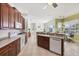 Bright, open kitchen leading to dining area and living room at 2931 Bravura Lake Dr, Sarasota, FL 34240