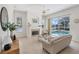 Bright living room with a fireplace and direct access to the pool area at 2931 Bravura Lake Dr, Sarasota, FL 34240