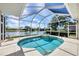 Beautiful screened lanai with pool and spa offers a perfect outdoor living space with a serene view at 2931 Bravura Lake Dr, Sarasota, FL 34240