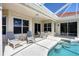 Relaxing screened lanai with pool, spa and patio furniture offers a perfect outdoor living space at 2931 Bravura Lake Dr, Sarasota, FL 34240