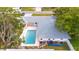 Aerial view of home with pool, yard, and gray roof at 2961 Valencia Rd, Venice, FL 34293