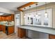 A spacious dining area featuring pendant lights, ample counter space, and views of the home's interior at 2961 Valencia Rd, Venice, FL 34293