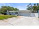Charming single-story home with a large front yard and attached garage at 2961 Valencia Rd, Venice, FL 34293