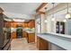 Bright kitchen with stainless appliances and a view into the dining area at 2961 Valencia Rd, Venice, FL 34293