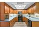 Traditional kitchen with wood cabinets, stainless steel appliances and plenty of counter space at 2961 Valencia Rd, Venice, FL 34293